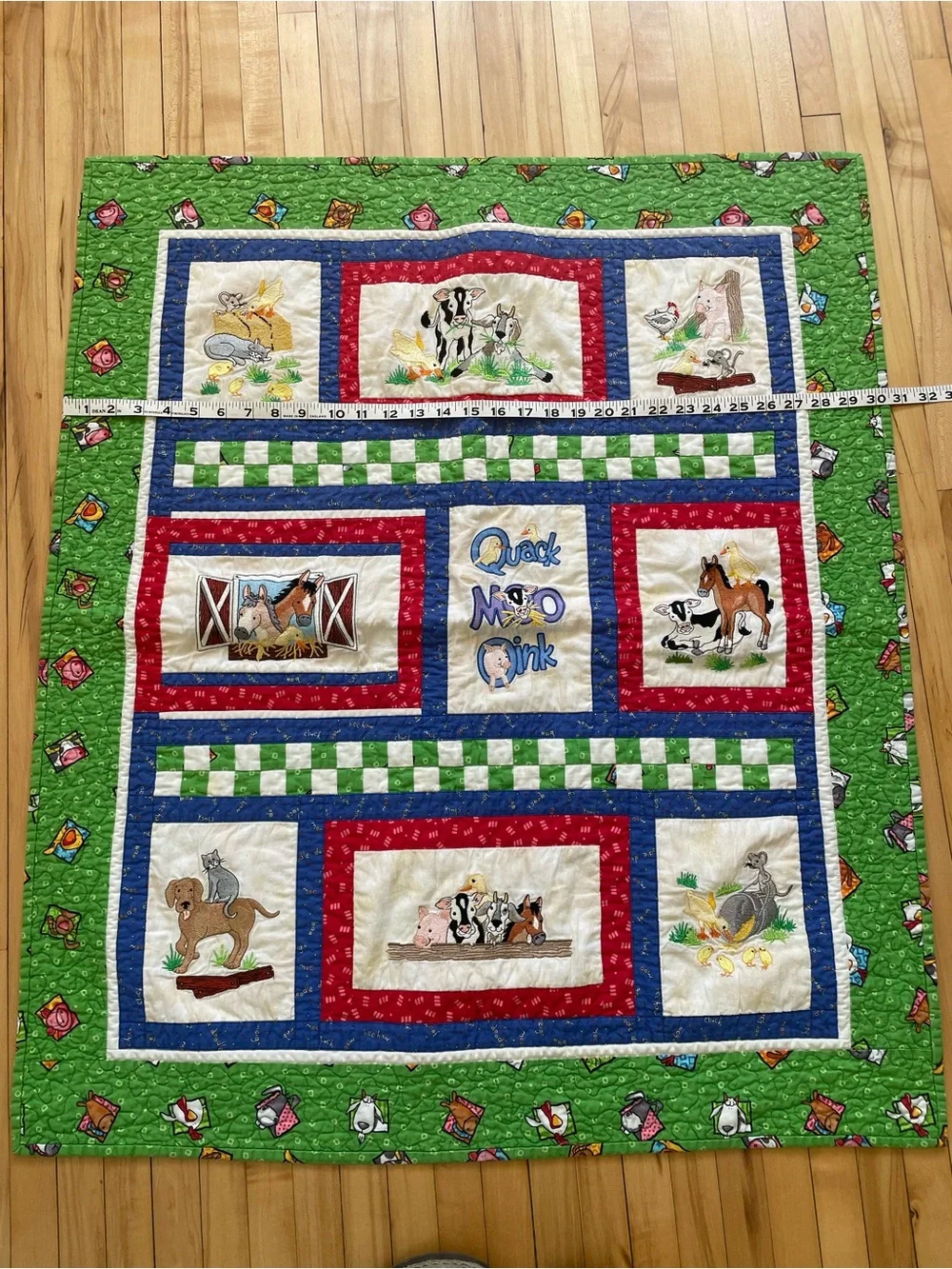 Quack, Moo, Oink quilt with farm animals and 'Quack, Moo, Oink'